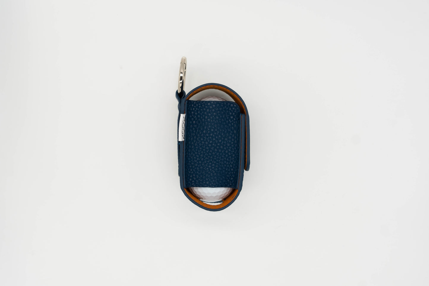 Navy leather golf ball pouch with noon brand logo at the side