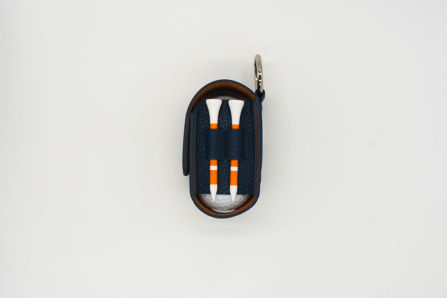 Navy leather golf ball pouch with two golf tees at the side