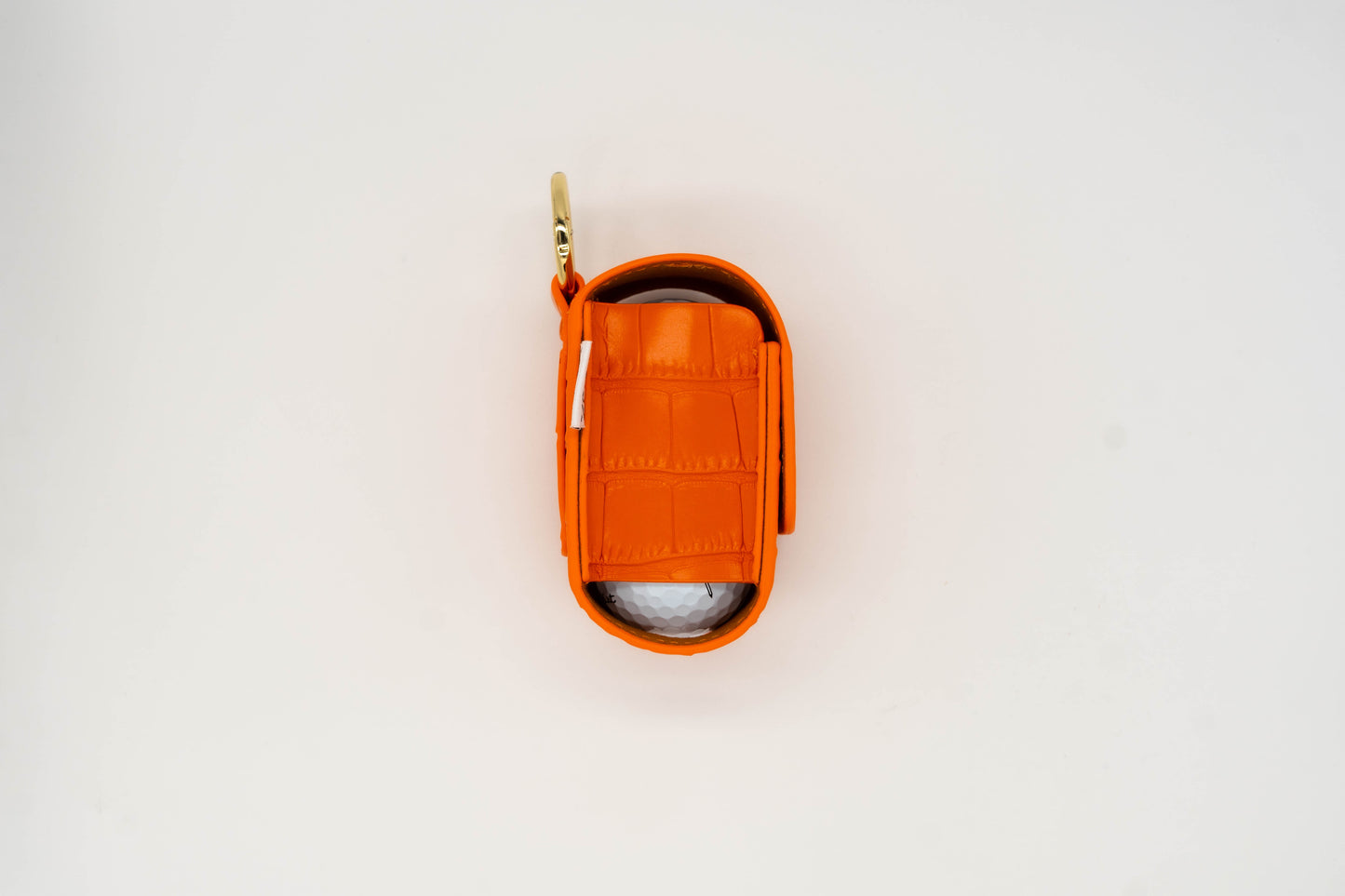 Orange leather golf ball pouch side view