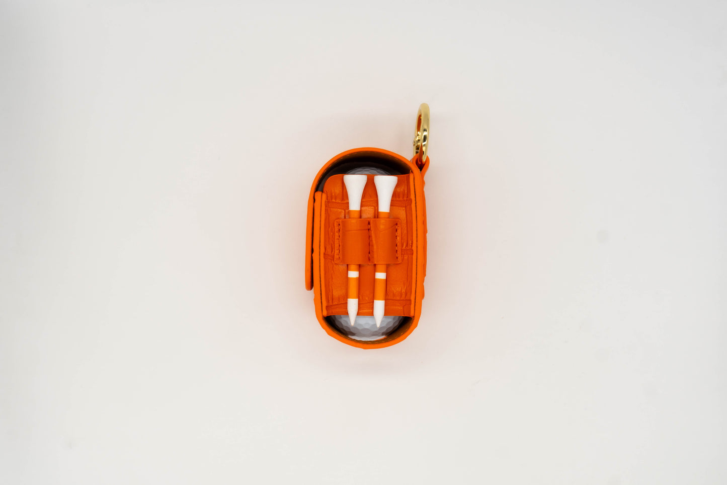 Orange leather golf ball pouch with two golf tees at the side
