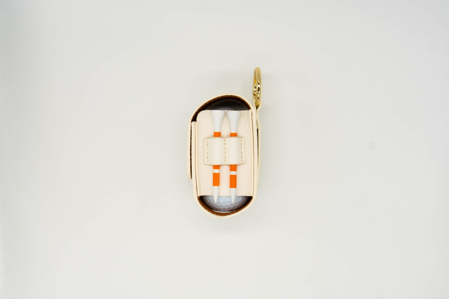 White leather golf ball pouch with two golf tees at the side
