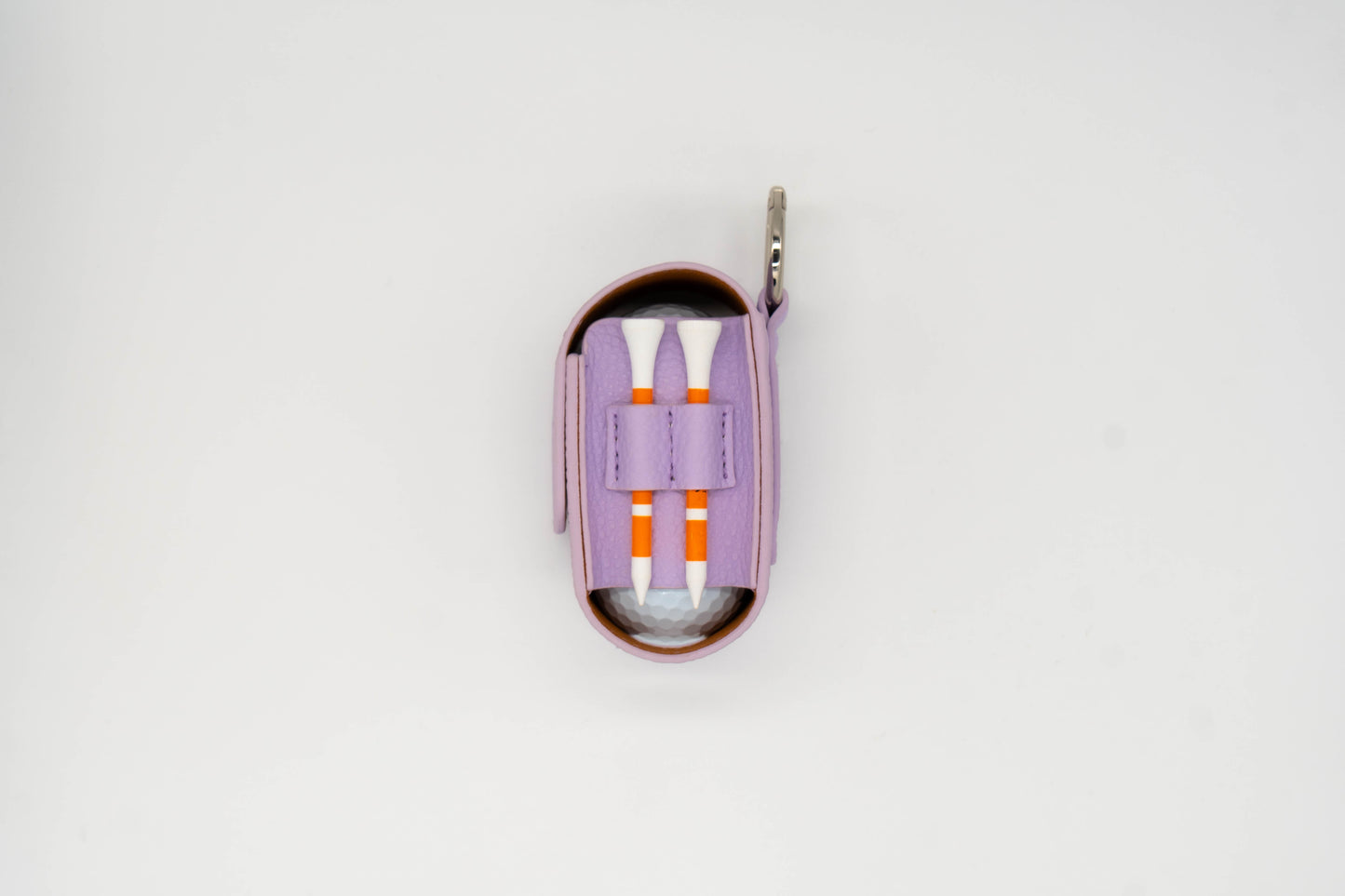 Purple leather golf ball pouch with two golf tees at the side