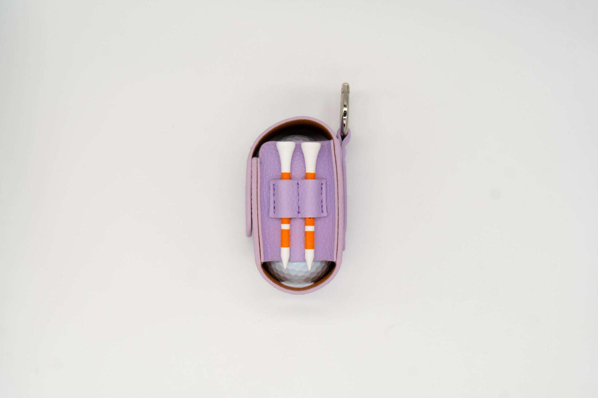 Purple leather golf ball pouch with two golf tees at the side
