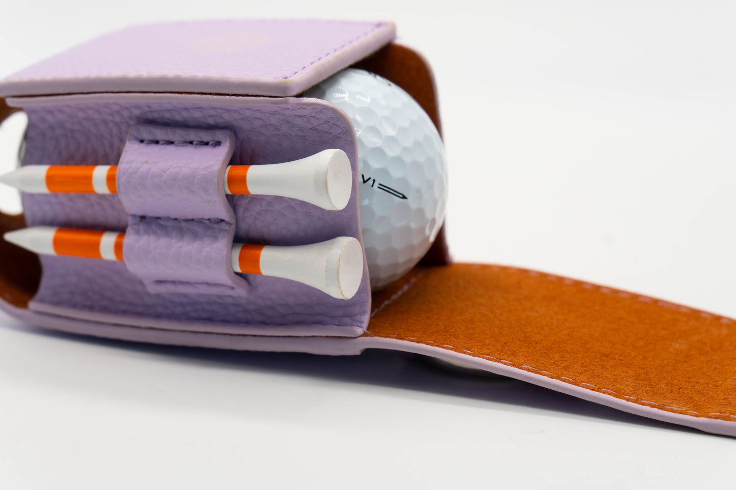 Purple golf ball pouch with golf balls and two golf tee holder