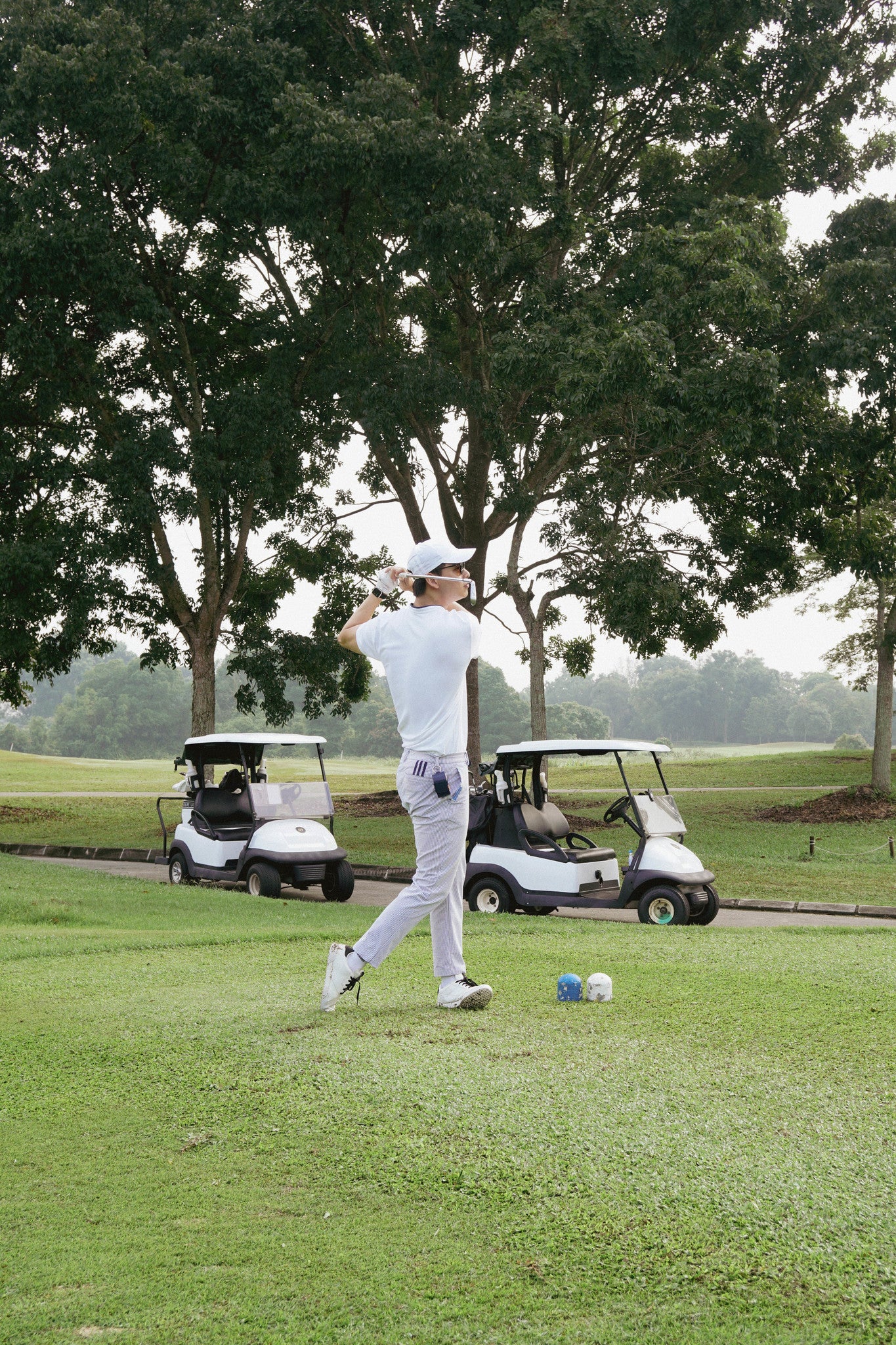 Navy golf ball pouch attached to belt hoop