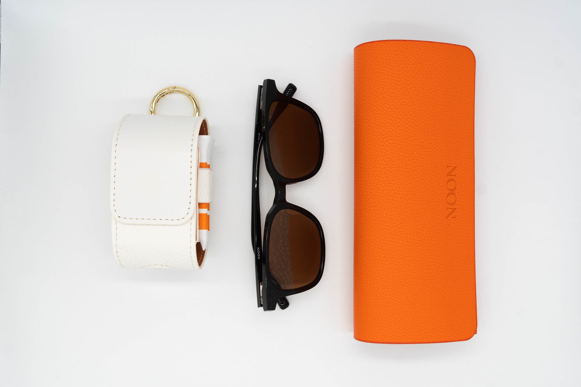 Full golf sunglasses set including the Paxton, Sunglasses case and a white Golf Ball Pouch