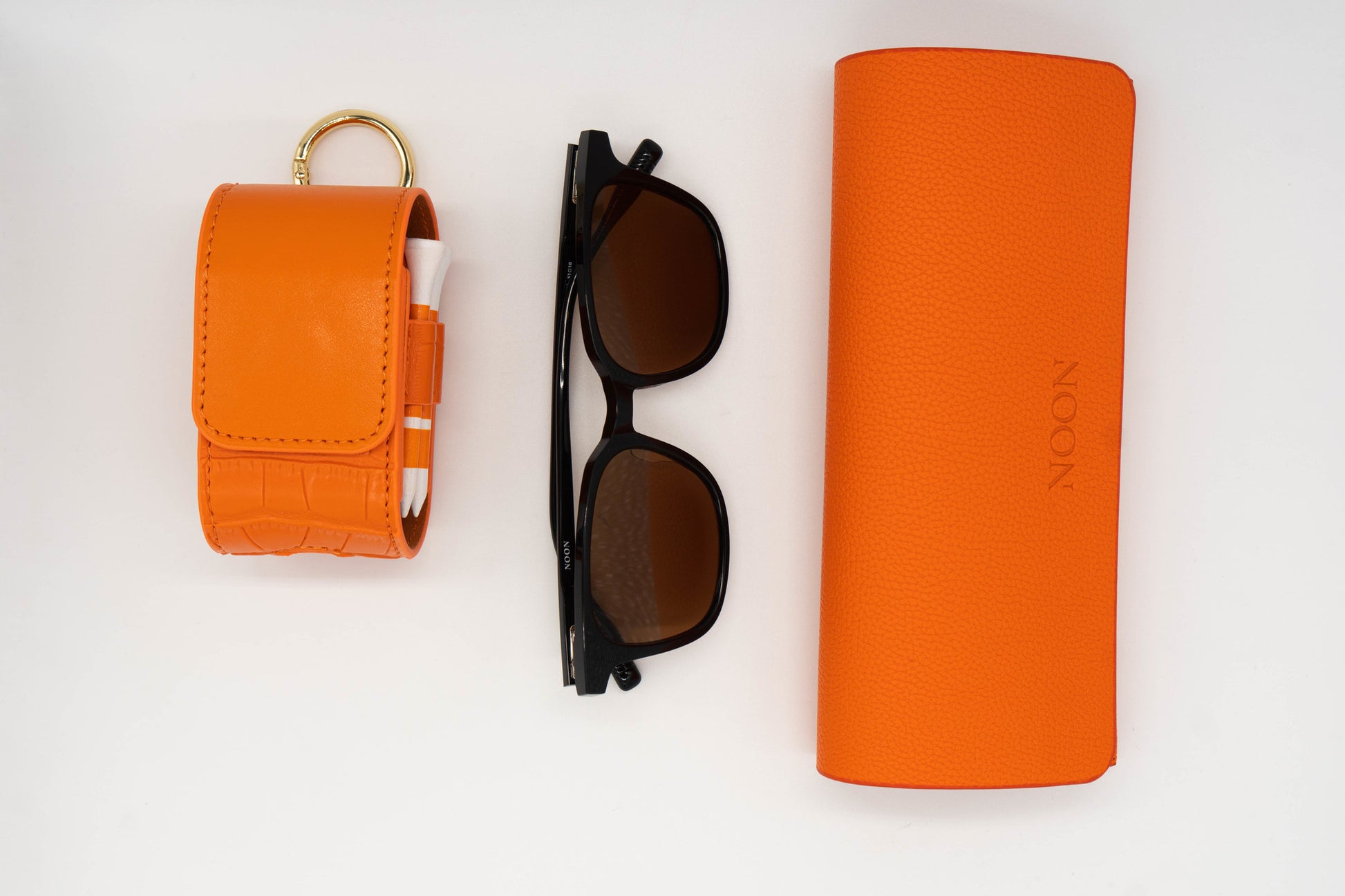 Full golf sunglasses set including the Paxton, Sunglasses case and a Orange Golf Ball Pouch